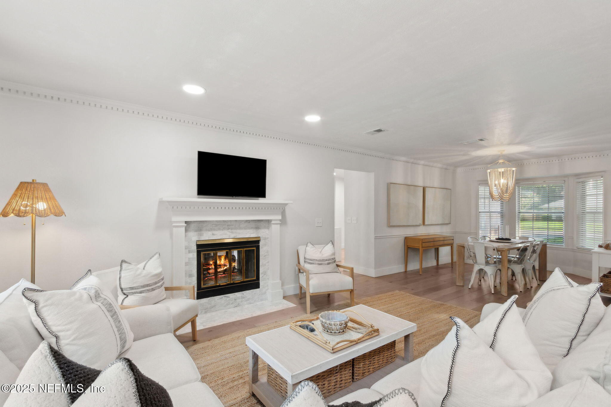 1908 Springbrook Road Fernandina Beach, FL 32034 - Photo 8 of 48 a living room with furniture a fireplace and a flat screen tv