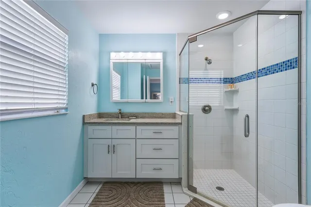 a bedroom with two beds and a table