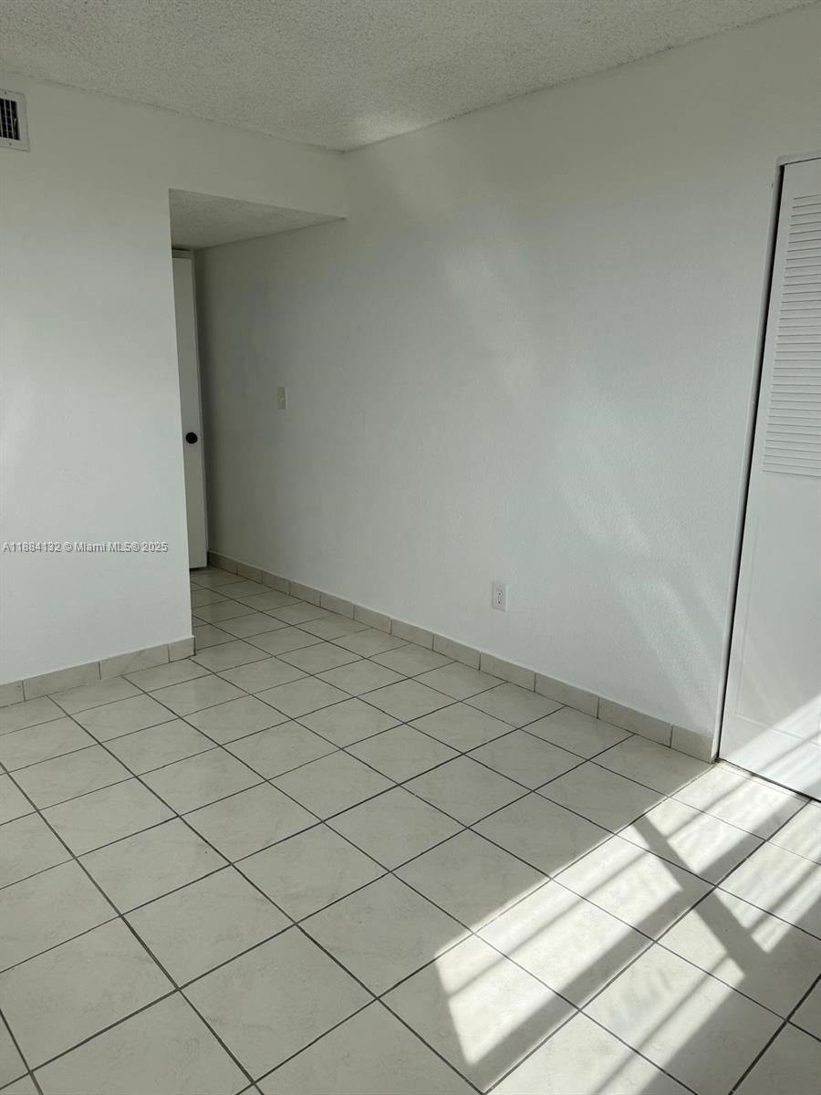 1255 West 53rd Street, Unit 202 Hialeah, FL 33012 - Photo 8 of 11 a view of empty room