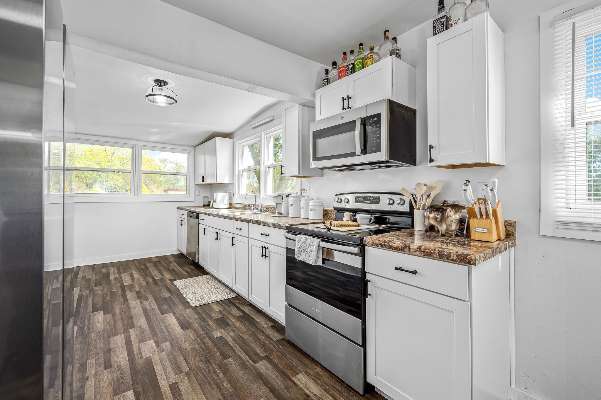 620 Maple Bend Road Winchester, TN 37398 - Photo 17 of 68 a kitchen with stainless steel appliances granite countertop a stove a sink and a microwave
