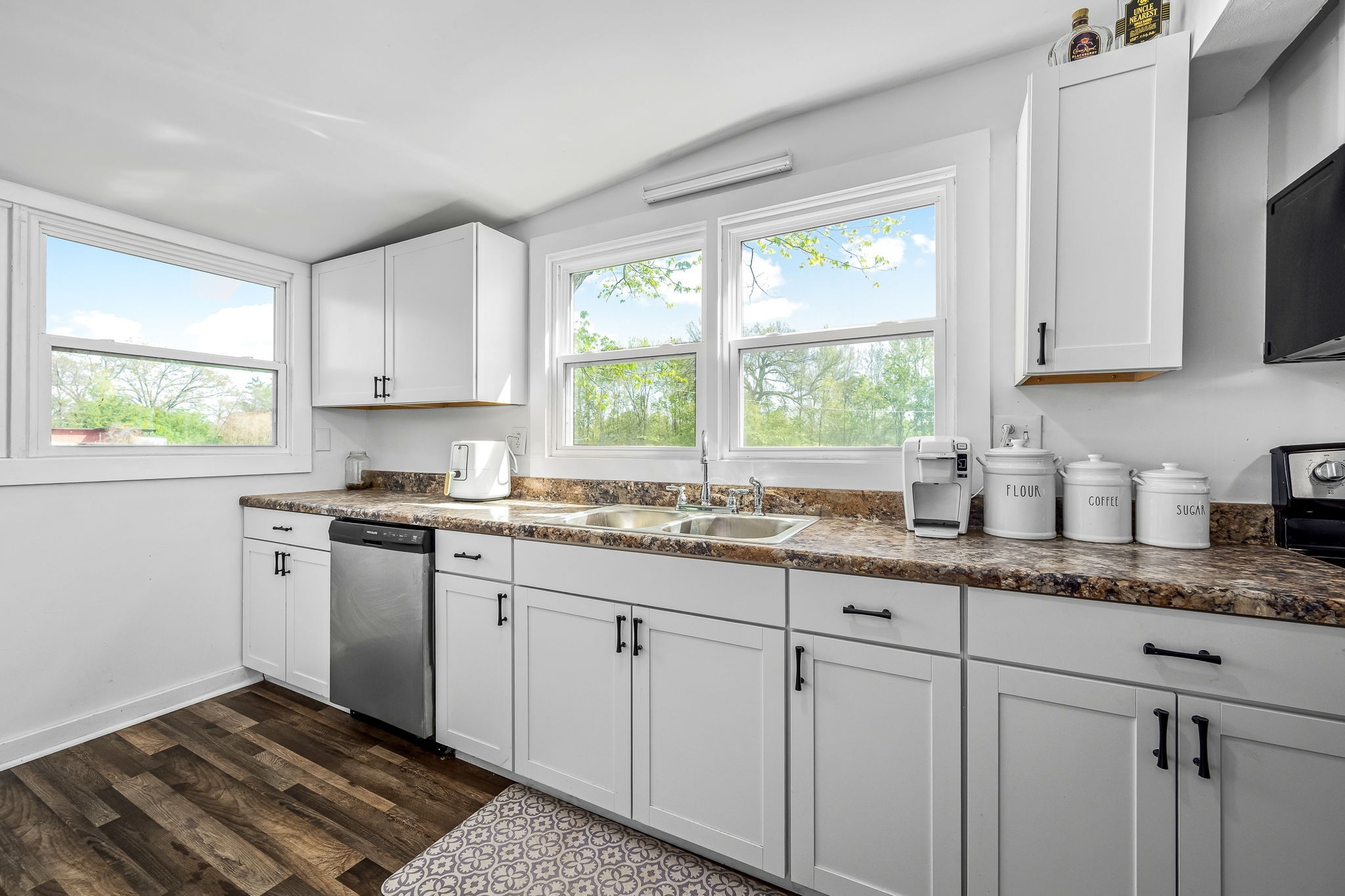 620 Maple Bend Road Winchester, TN 37398 - Photo 18 of 68 a kitchen with granite countertop white cabinets sink and window