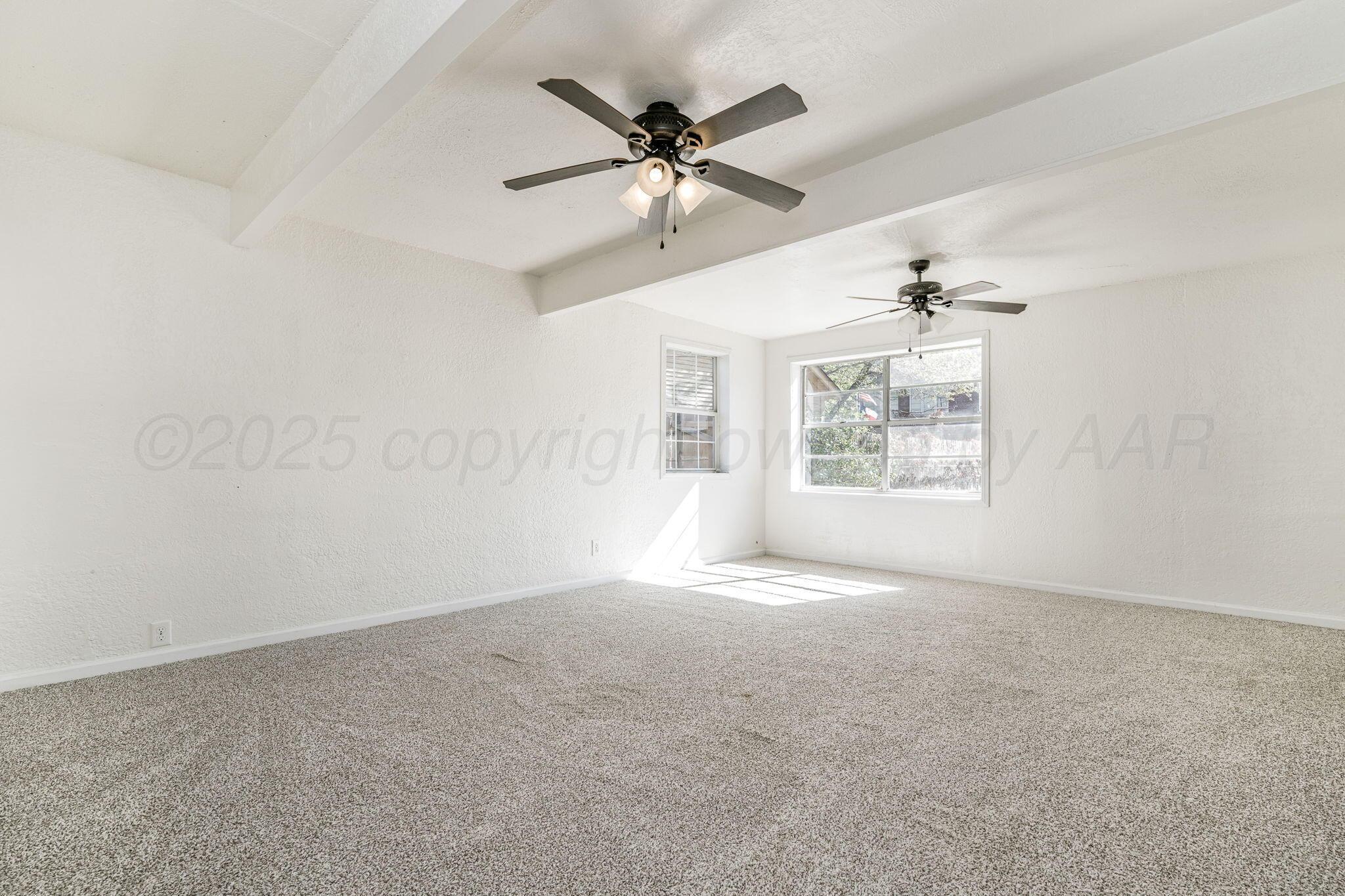 606 Sunset Terrace Amarillo, TX 79106 - Photo 12 of 16 a view of an empty room with a window