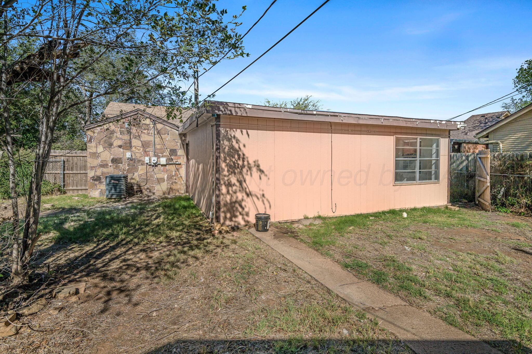 606 Sunset Terrace Amarillo, TX 79106 - Photo 15 of 16 a view of a house with a backyard