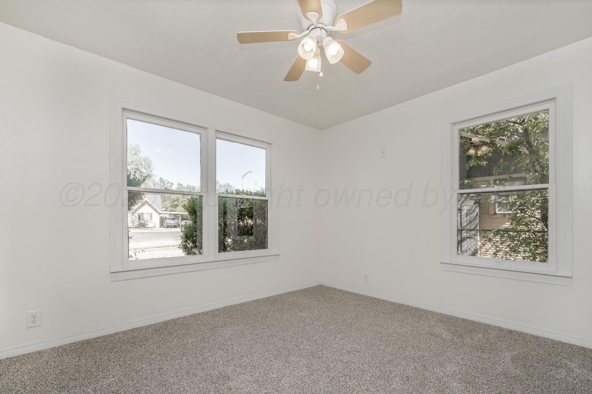 606 Sunset Terrace Amarillo, TX 79106 - Photo 8 of 16 an empty room with a window