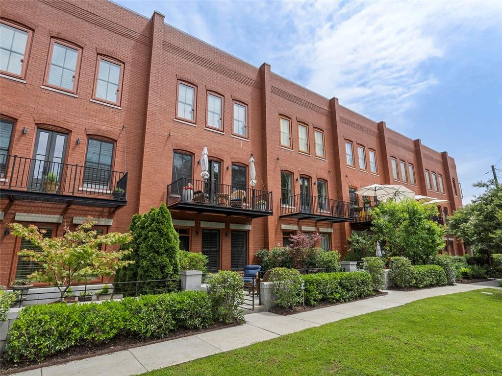 432 East Howard Avenue, Unit 19 Decatur, GA 30030 - Photo 1 of 1 a building view with a garden space