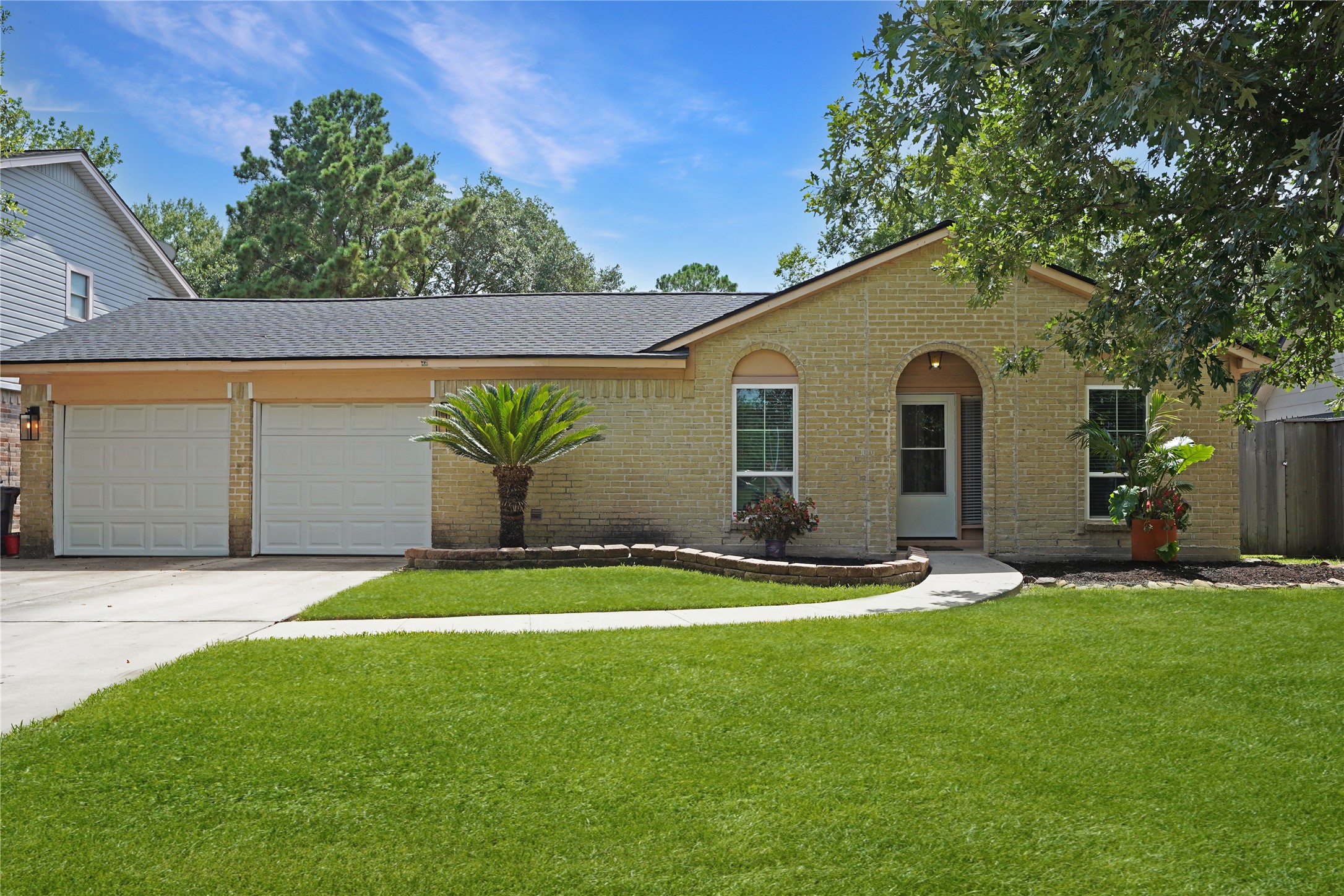 17119 Mellow Ridge Drive Spring, TX 77379 - Photo 3 of 32 This charming single-story home features a brick exterior, a well-maintained lawn, and a two-car garage. The front yard includes a walkway with attractive landscaping, and mature trees provide shade and curb appeal.