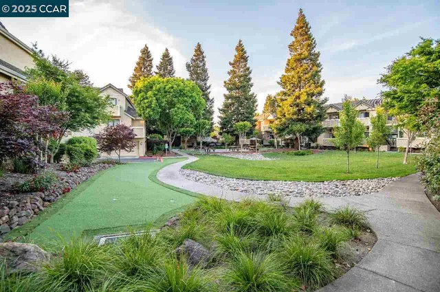 a patio with a table and chairs