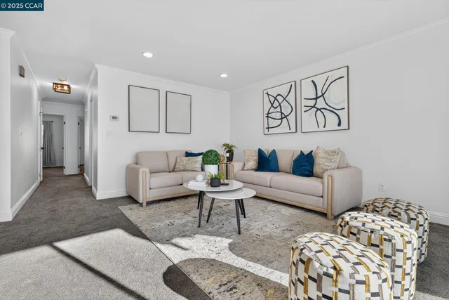 a living room with furniture and white walls