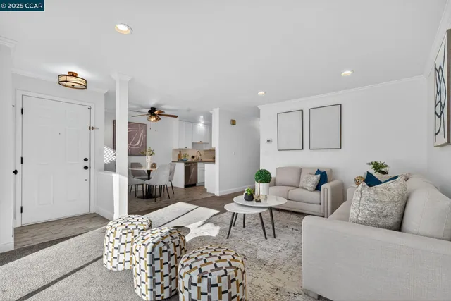 a living room with furniture and a rug