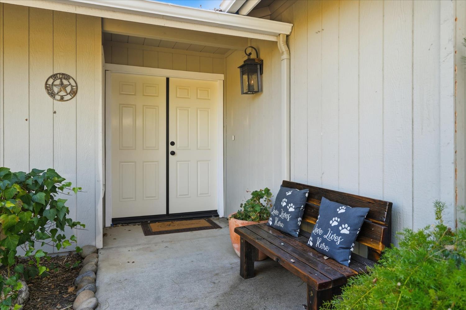 32583 River Knolls Road Coarsegold, CA 93614 - Photo 9 of 63 a bench sitting in front of a door