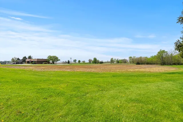 a view of an ocean and a yard