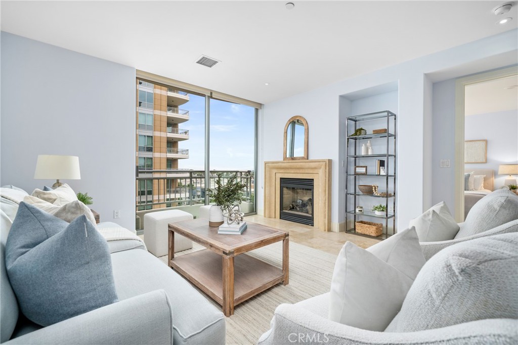 5082 Scholarship Irvine, CA 92612 - Photo 1 of 30 a living room with furniture and a fireplace