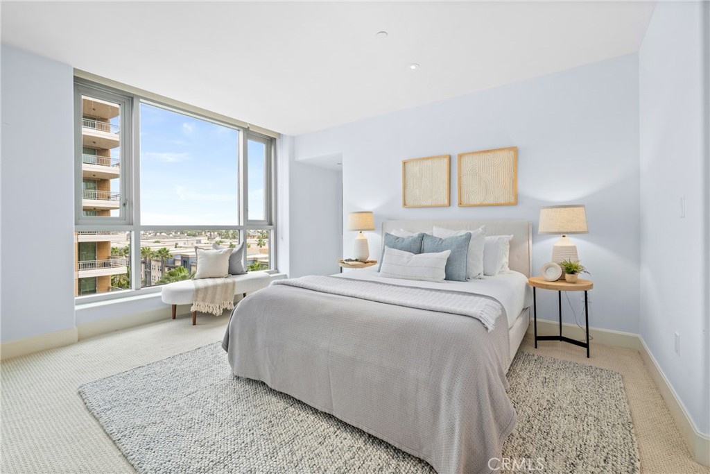 5082 Scholarship Irvine, CA 92612 - Photo 11 of 30 a spacious bedroom with a bed and glass window