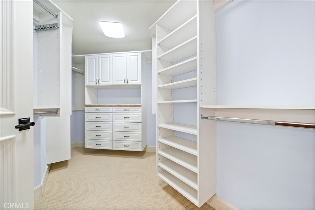 5082 Scholarship Irvine, CA 92612 - Photo 15 of 30 a view of walk in closet with clothes