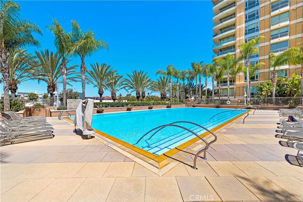 5082 Scholarship Irvine, CA 92612 - Photo 21 of 30 a view of swimming pool with outdoor seating and a palm tree
