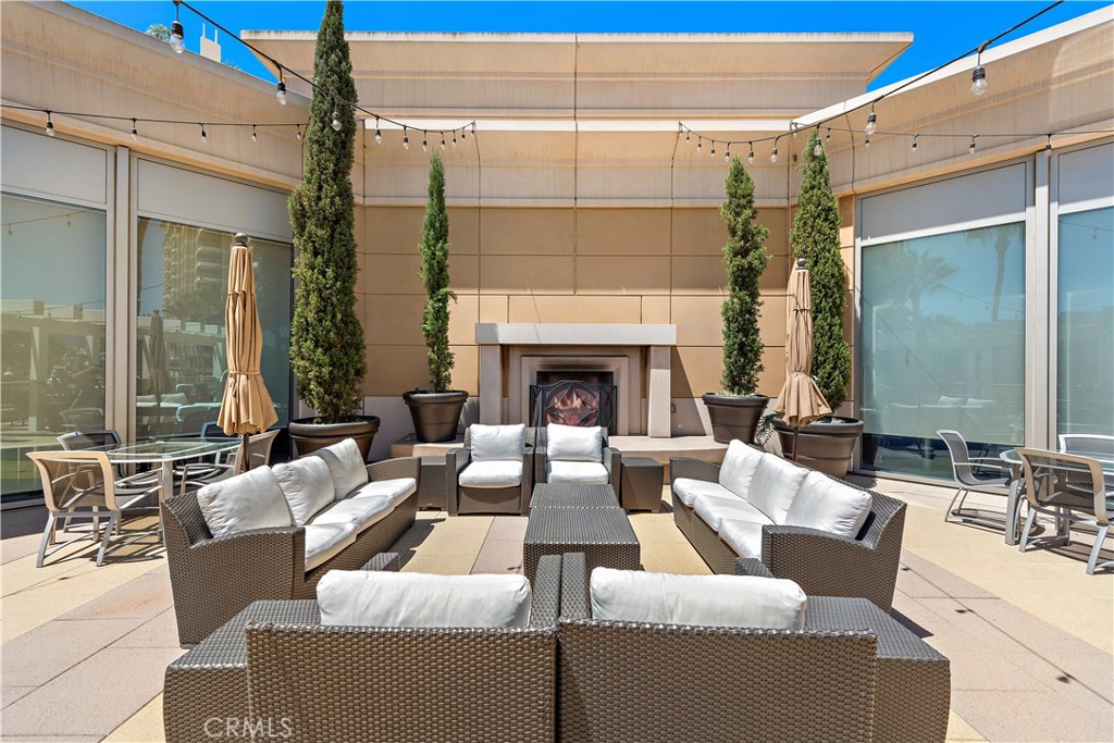5082 Scholarship Irvine, CA 92612 - Photo 23 of 30 a outdoor living space with patio furniture and a fireplace