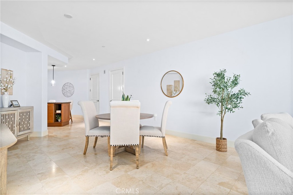 5082 Scholarship Irvine, CA 92612 - Photo 8 of 30 a living room with furniture a mirror and a potted plant