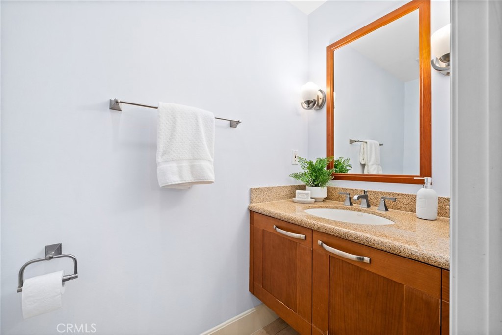 5082 Scholarship Irvine, CA 92612 - Photo 9 of 30 a bathroom with a sink and a mirror