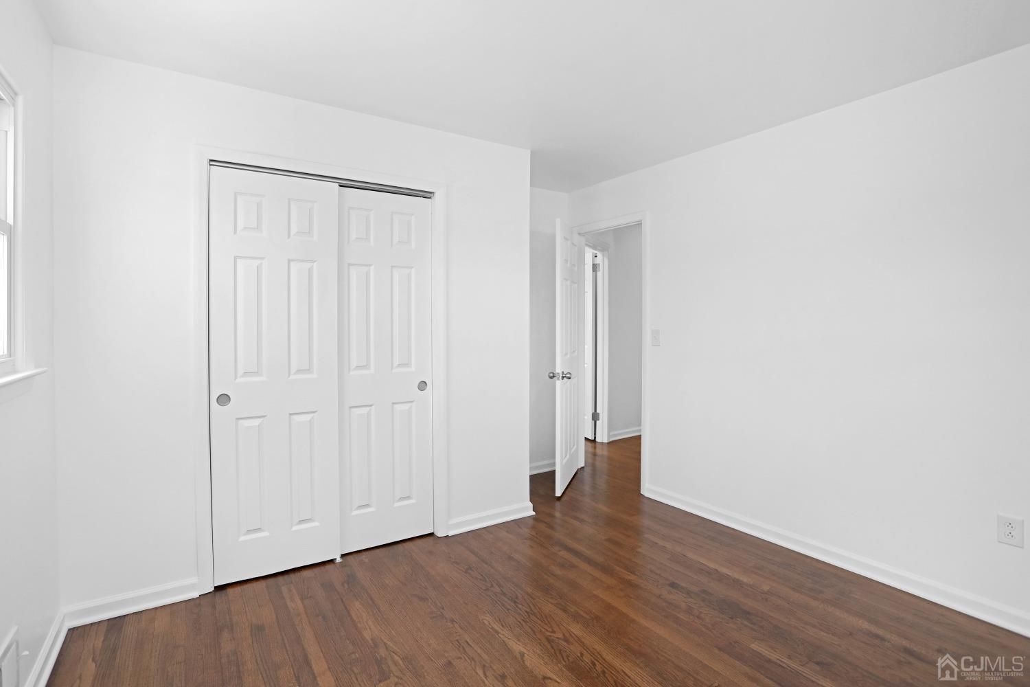 25 Mercer Road Old Bridge, NJ 08857 - Photo 22 of 30 a view of an empty room with wooden floor and closet