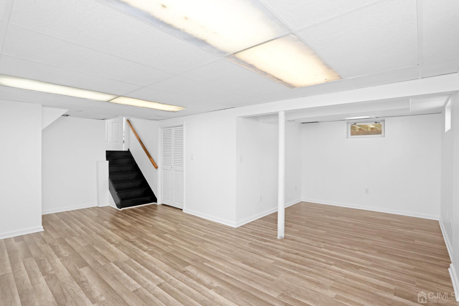 25 Mercer Road Old Bridge, NJ 08857 - Photo 25 of 30 a view of an empty room with wooden floor