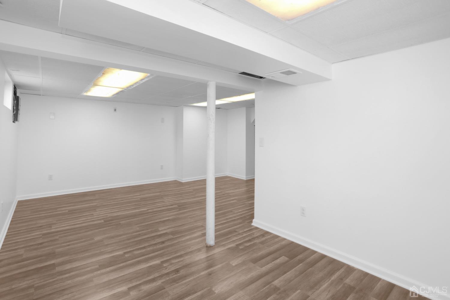 25 Mercer Road Old Bridge, NJ 08857 - Photo 26 of 30 a view of an empty room with wooden floor