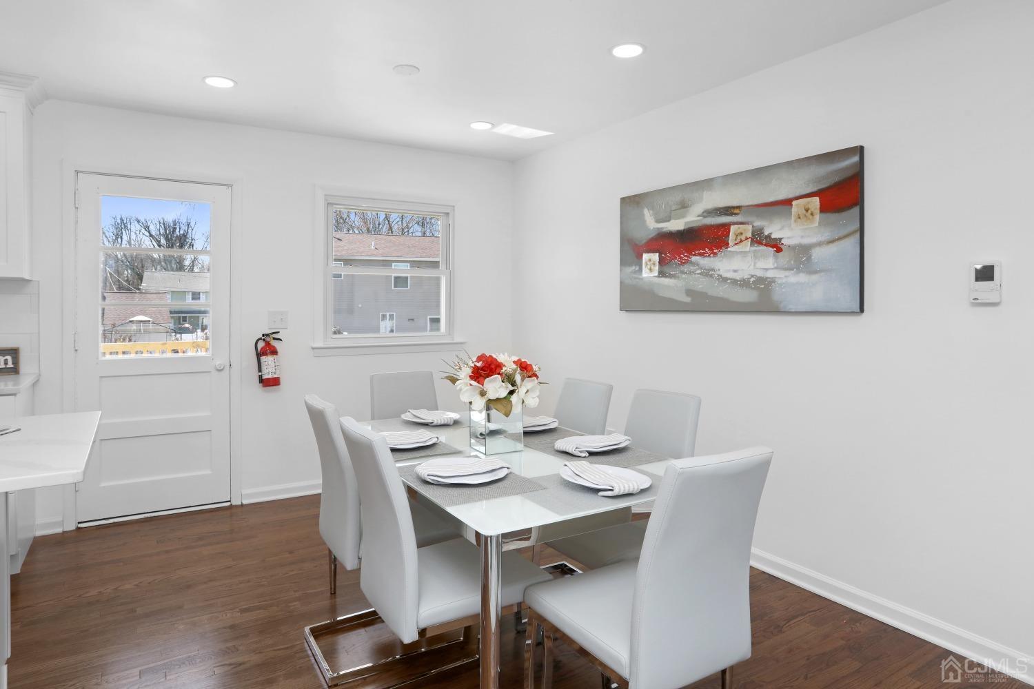 25 Mercer Road Old Bridge, NJ 08857 - Photo 9 of 30 a view of a dining room with furniture wooden floor and a painting