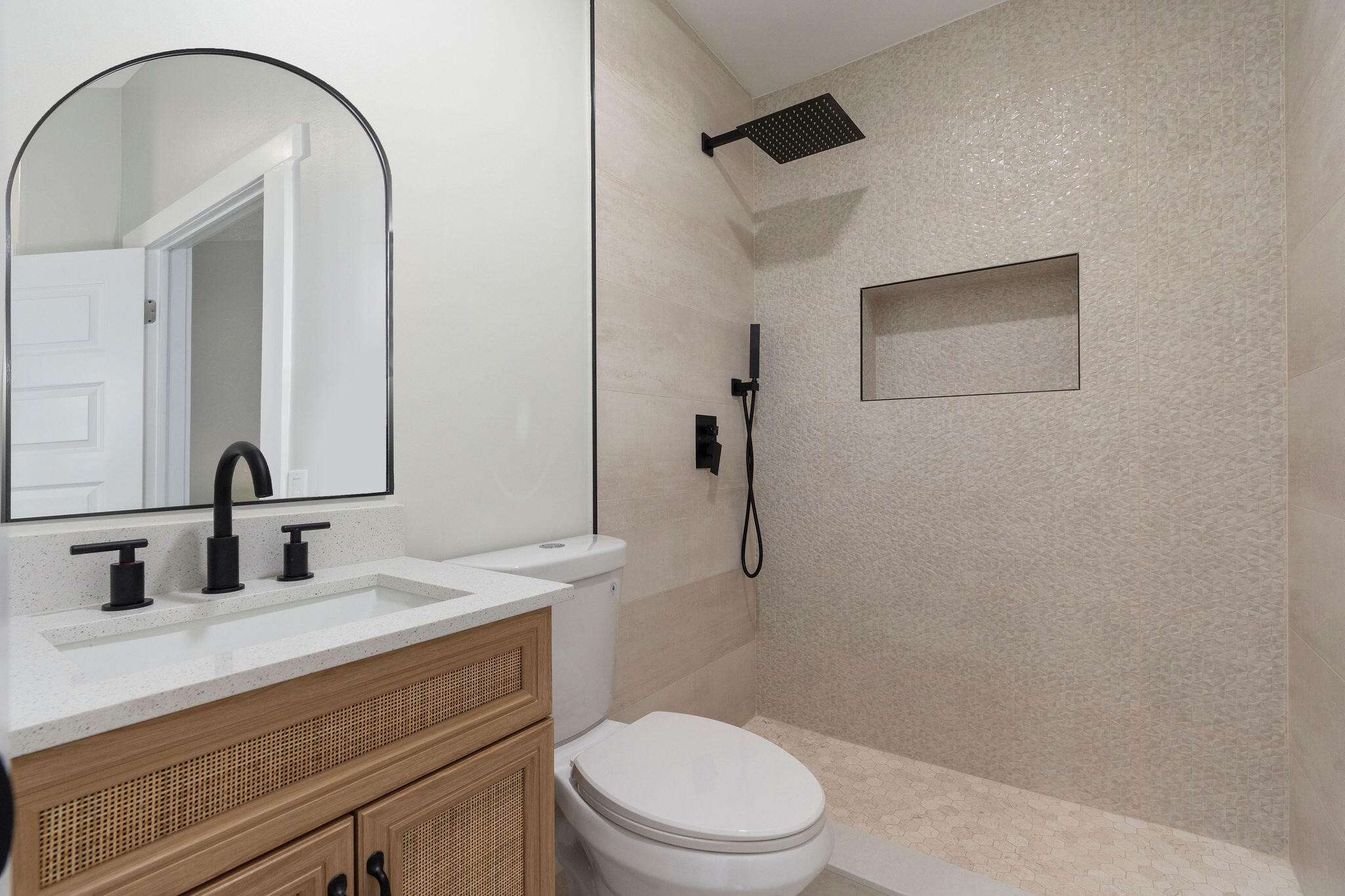 5580 Maypop Road West Palm Beach, FL 33415 - Photo 18 of 41 a bathroom with a toilet a sink and mirror