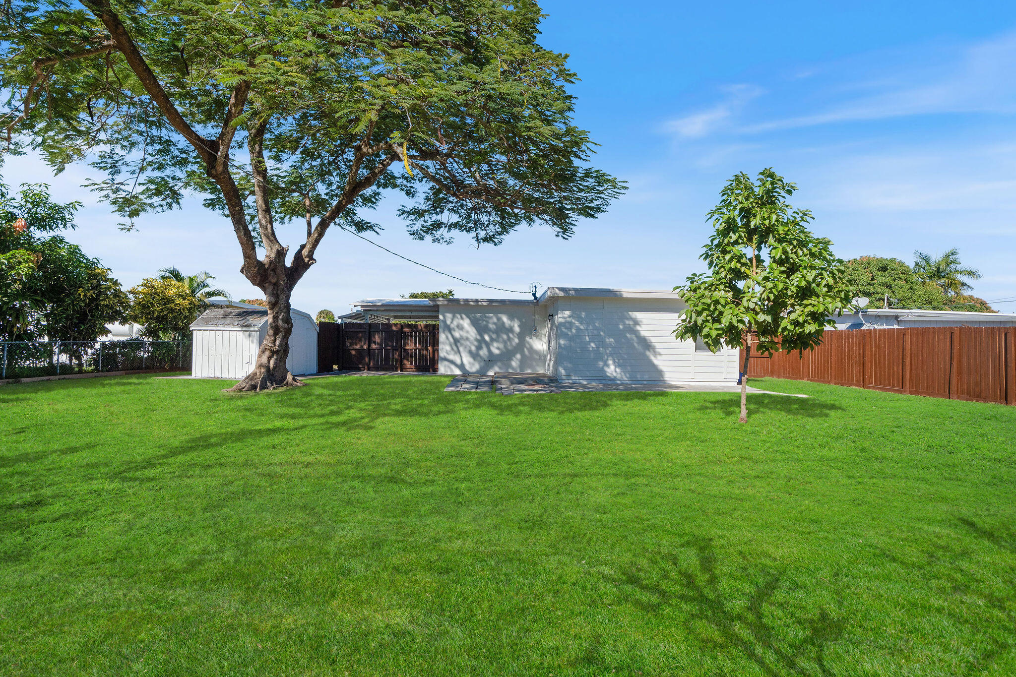 5580 Maypop Road West Palm Beach, FL 33415 - Photo 25 of 41 a front view of a house with garden