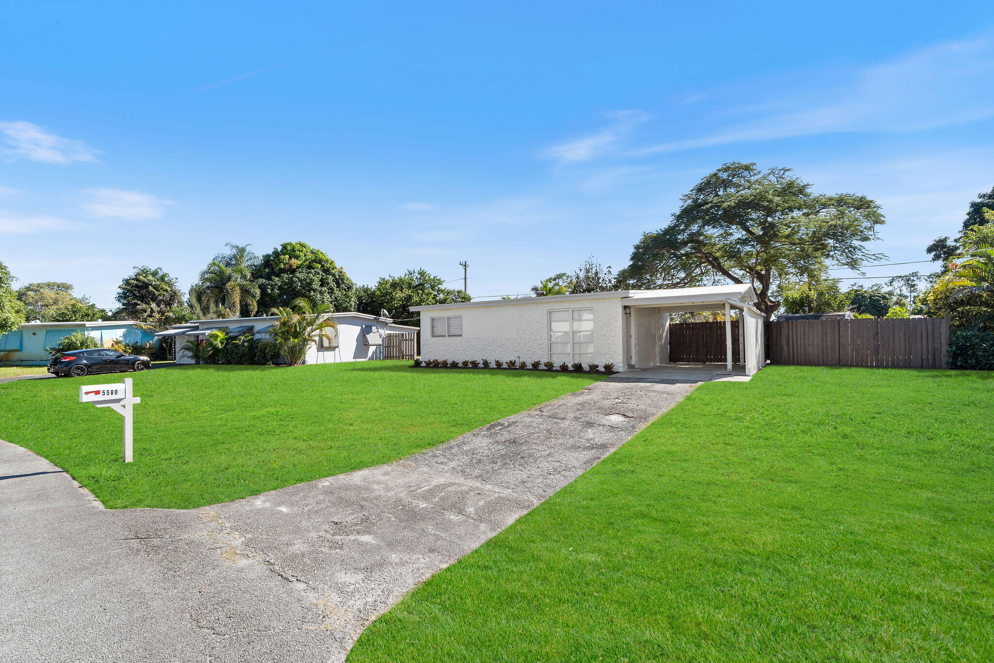 5580 Maypop Road West Palm Beach, FL 33415 - Photo 3 of 41 a view of a house with a yard