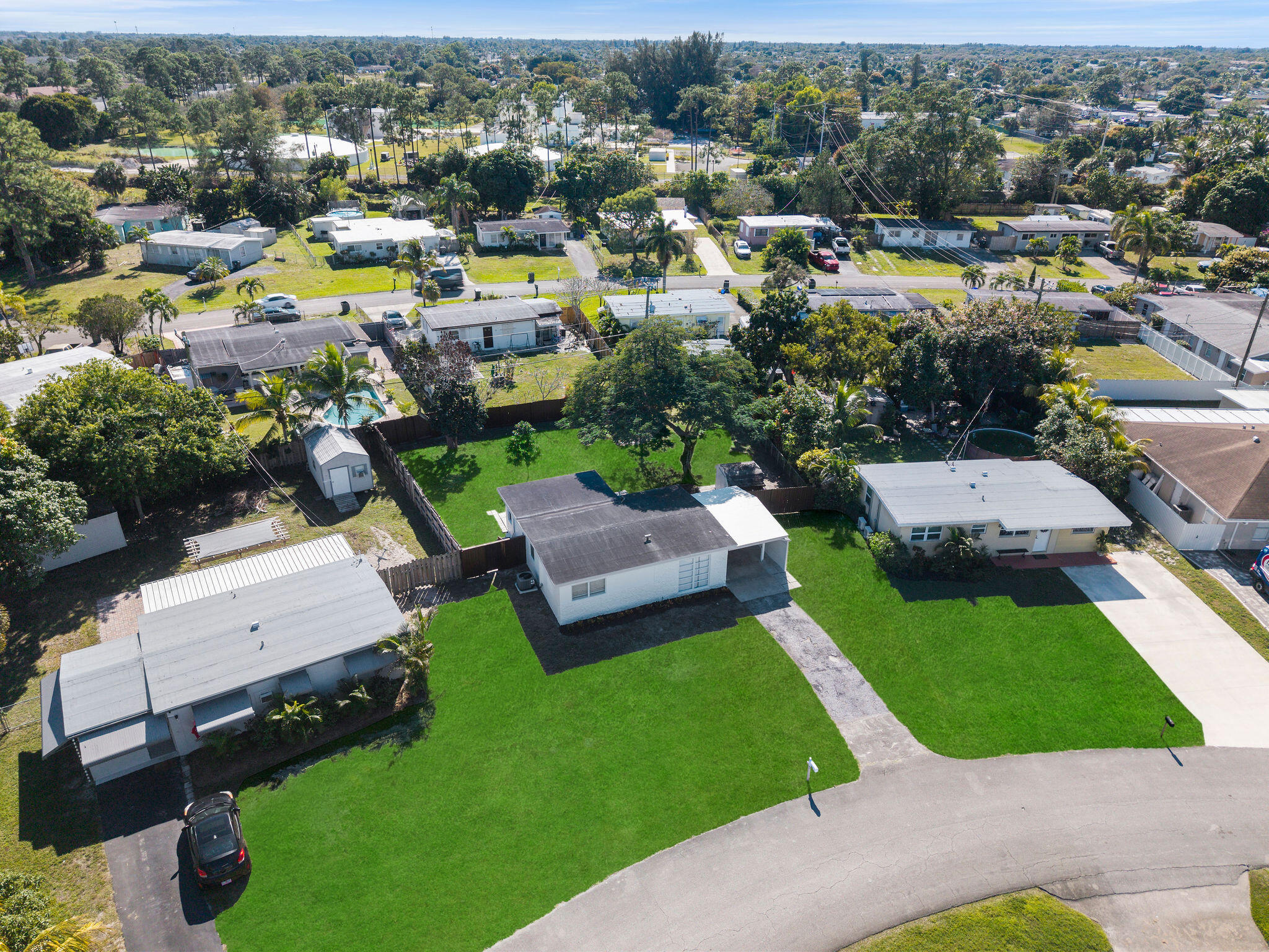 5580 Maypop Road West Palm Beach, FL 33415 - Photo 31 of 41 an aerial view of a house with a garden and lake view