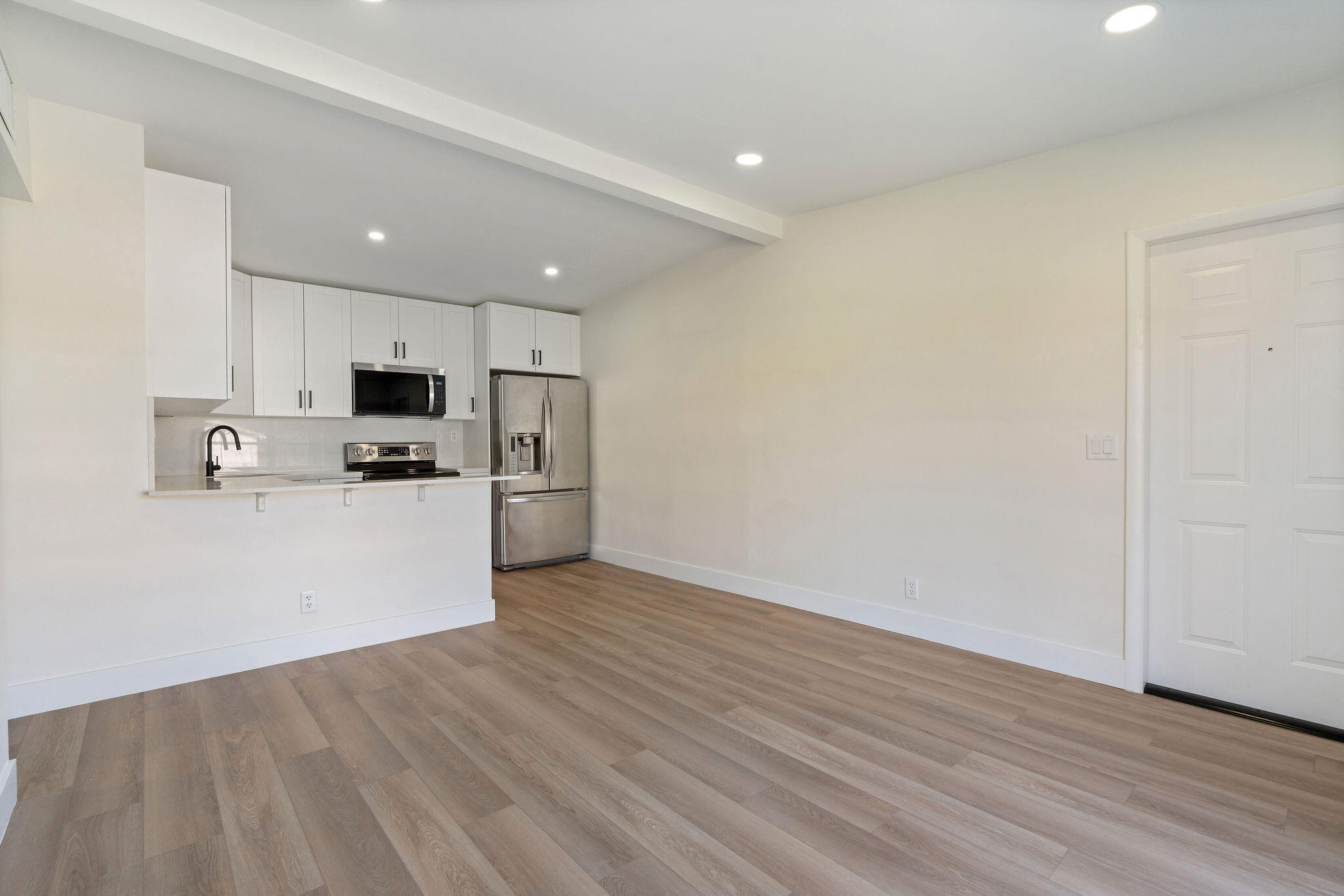 5580 Maypop Road West Palm Beach, FL 33415 - Photo 4 of 41 a view of kitchen with microwave and cabinets