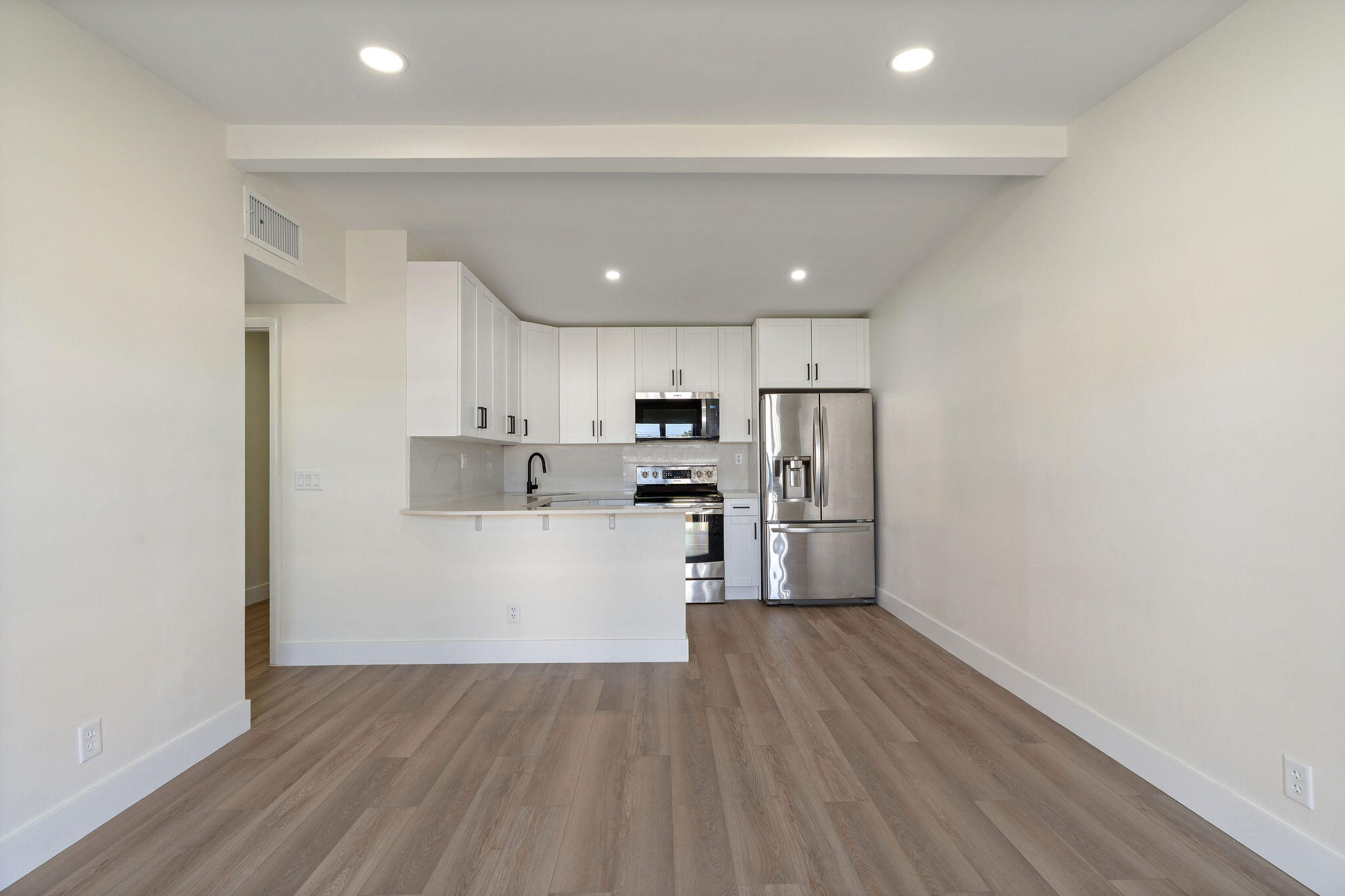 5580 Maypop Road West Palm Beach, FL 33415 - Photo 6 of 41 a view of kitchen with wooden floor