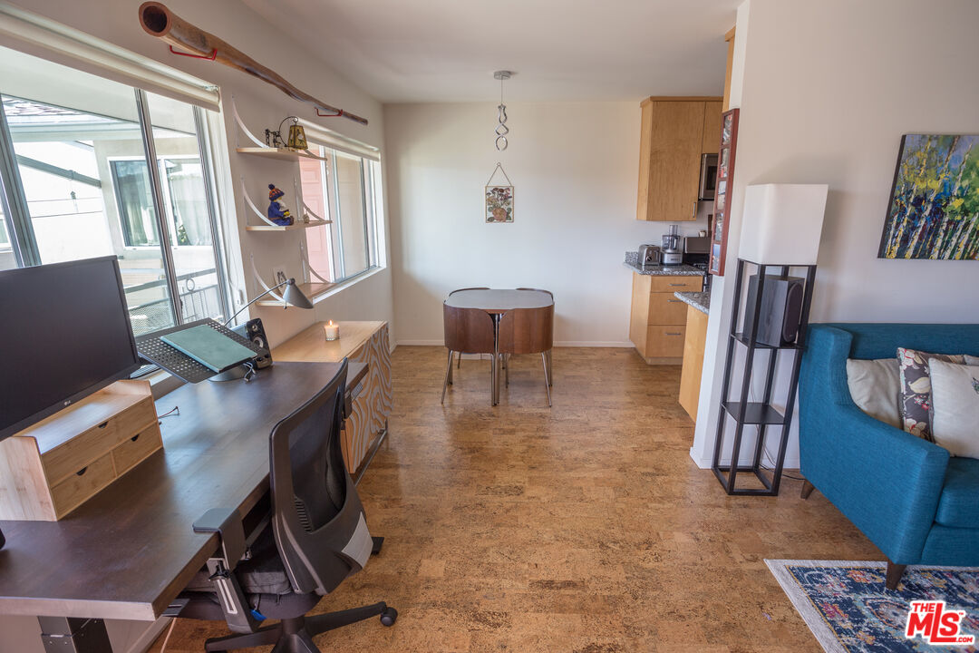 4209 McLaughlin Avenue, Unit 4 Los Angeles, CA 90066 - Photo 2 of 9 a workspace with furniture and wooden floor
