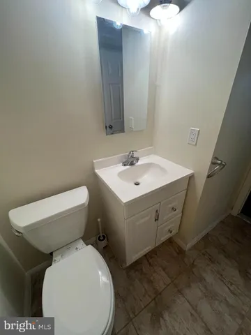 a close view of a toilet sink and a mirror