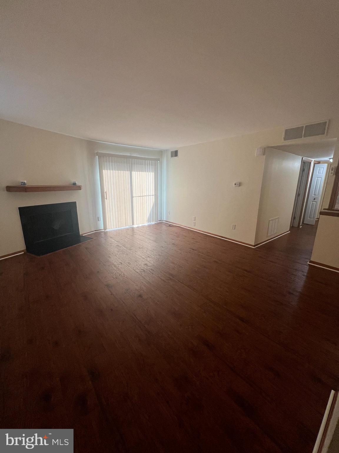 25 South Church Road Maple Shade, NJ 08052 - Photo 7 of 25 a view of an empty room with wooden floor and a window