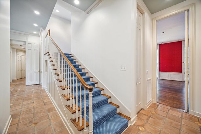 a view of a hallway with staircase