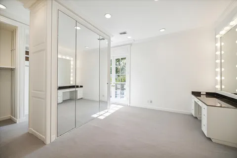 a view of a kitchen with a sink and a refrigerator