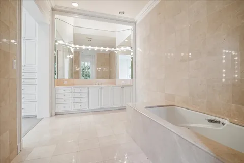a bathroom with a bathtub and shower
