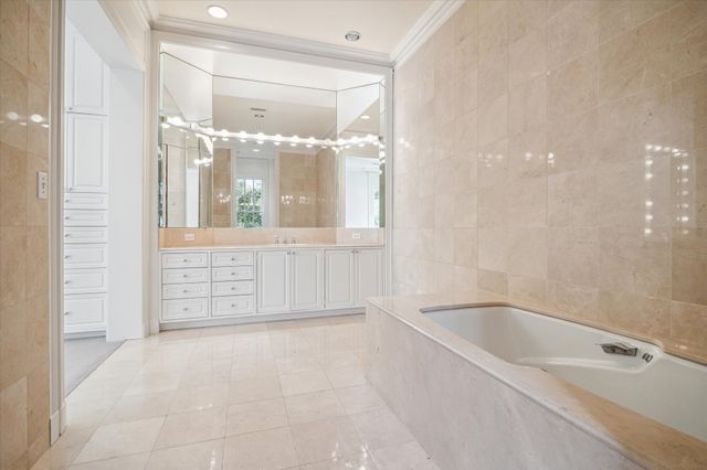 a bathroom with a bathtub and shower