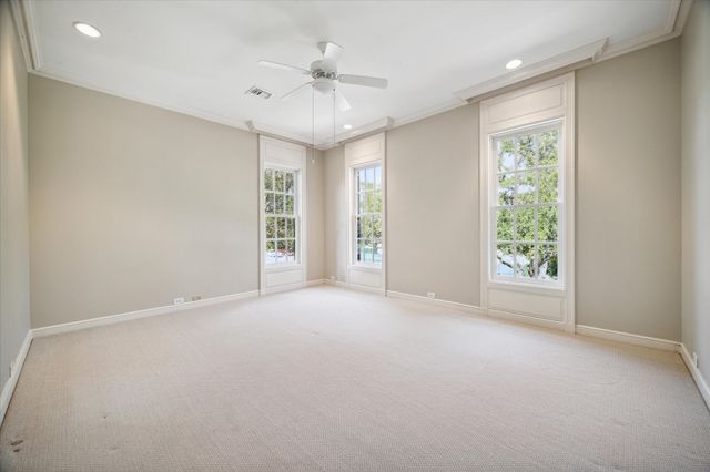 an empty room with windows and closet