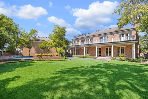 a view of a house with a yard porch and sitting area