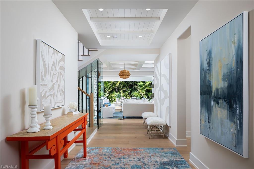 1040 2nd Street South Naples, FL 34102 - Photo 14 of 42 a living room with furniture and a potted plant