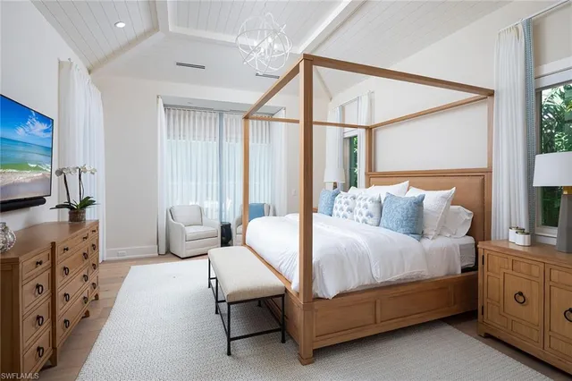 a bedroom with bed and window