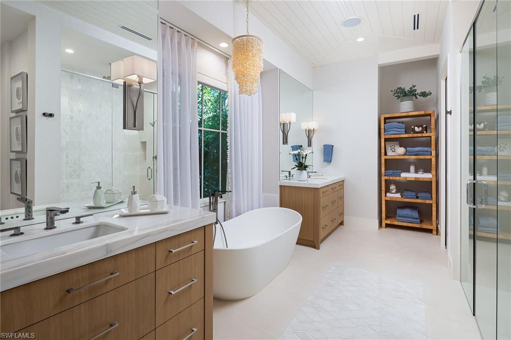 1040 2nd Street South Naples, FL 34102 - Photo 16 of 42 a bathroom with a sink a toilet and shower