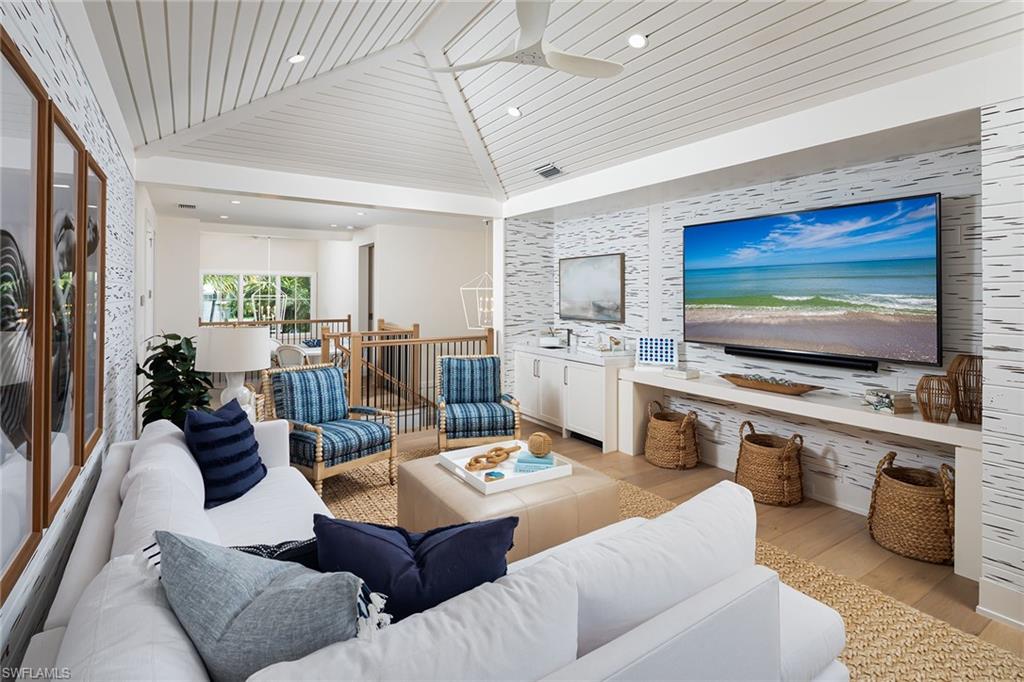 1040 2nd Street South Naples, FL 34102 - Photo 20 of 42 a living room with furniture and a flat screen tv