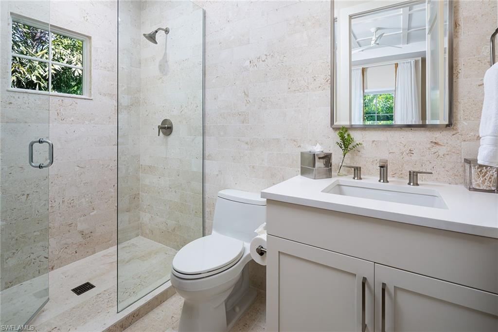 1040 2nd Street South Naples, FL 34102 - Photo 22 of 42 a bathroom with a sink toilet and shower