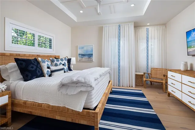 a bedroom with bed and window