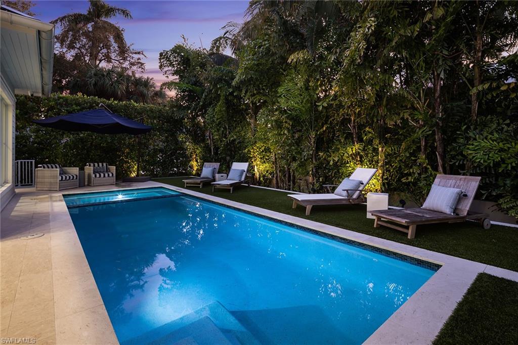1040 2nd Street South Naples, FL 34102 - Photo 37 of 42 a view of a swimming pool with a patio