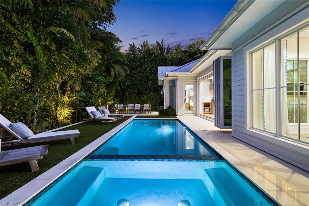 1040 2nd Street South Naples, FL 34102 - Photo 38 of 42 a view of swimming pool with chairs