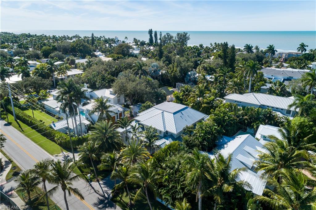 1040 2nd Street South Naples, FL 34102 - Photo 40 of 42 an aerial view of a house with yard and outdoor seating